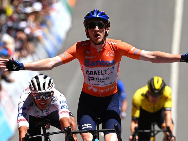 MOUNT LOFTY, AUSTRALIA - JANUARY 21: Stephen Williams of United Kingdom and Team Israel - Premier Tech - Orange Santos Leader's Jersey celebrates at finish line as stage winner ahead of Isaac Del Toro Romero of Mexico and UAE Team Emirates and Jhonatan Narvaez of Ecuador and Team INEOS Grenadiers during the 24th Santos Tour Down Under 2024, Stage 6 a 128.2km stage from Unley to Mount Lofty 648m / #UCIWT / on January 21, 2024 in Mount Lofty, Australia. (Photo by Tim de Waele/Getty Images)