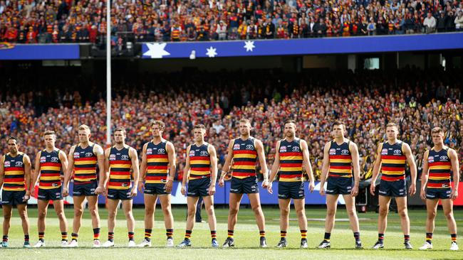 Adelaide Crows players adopt their Crows stare for the national anthem before the 2017 AFL Grand Final. The concept was the idea of Collective Mind. Picture: Darrian Traynor/AFL Media/Getty Images)