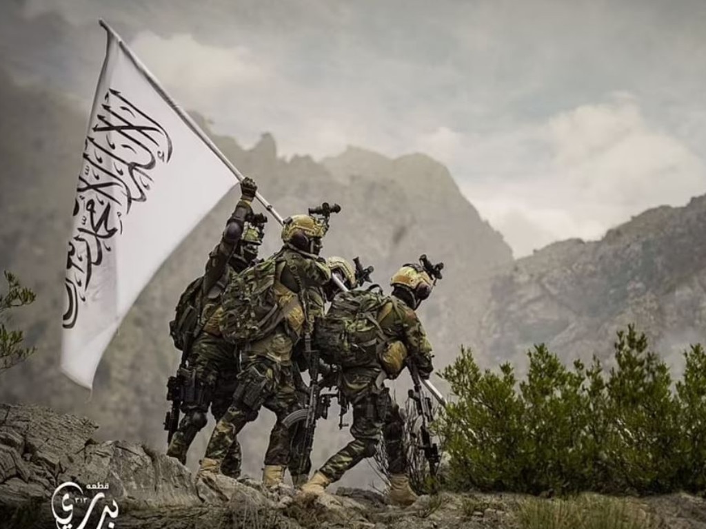 Badri 313 Battalion members of the Taliban hoisting a Taliban flag. Picture: Taliban