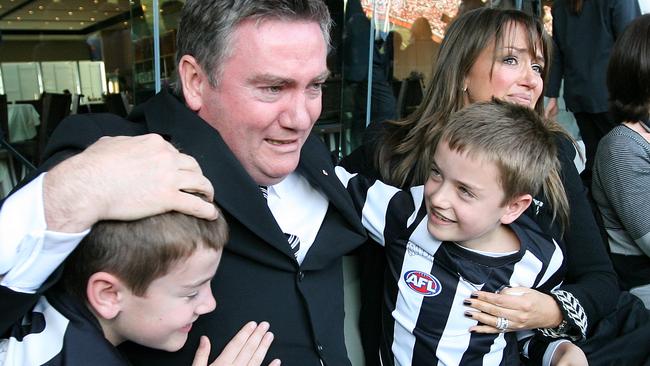 Eddie McGuire celebrates Collingwood's premiership win with wife Carla and sons Joseph and Alexander.