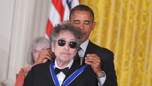 US President Barack Obama presents the Presidential Medal of Freedom to musician Bob Dylan in 2012. The award is the country's highest civilian honour. Picture: Supplied