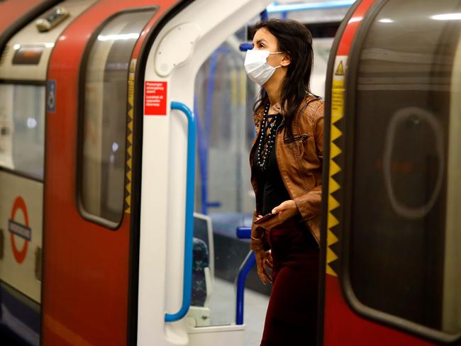 Face coverings are now compulsory for people wanting to travel on public transport in England to limit the spread of coronavirus. Picture: Tolga Akmen / AFP