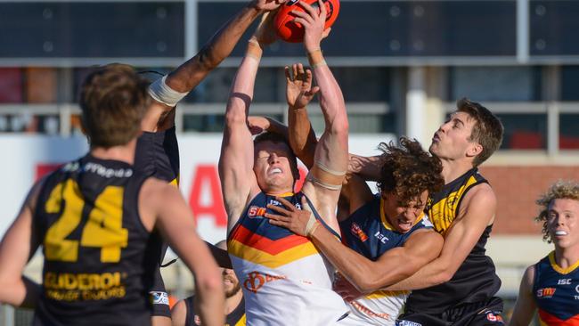 Adelaide's Reilly O'Brien marks strongly for the Crows in a 2018 SANFL game against Glenelg. Picture: AAP Image/ Brenton Edwards