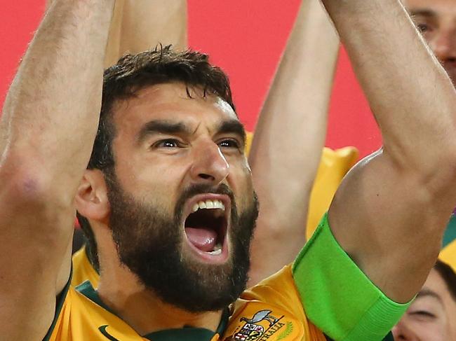 SYDNEY, AUSTRALIA - JANUARY 31: Mile Jedinak of Australia and his team celebrate as he lifts the trophy after victory during the 2015 Asian Cup final match between Korea Republic and the Australian Socceroos at ANZ Stadium on January 31, 2015 in Sydney, Australia. (Photo by Mark Kolbe/Getty Images)