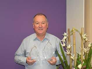 Rodney Turner, director of OBT Financial, with the group's 2015 Business Awards. Picture: Nathan Greaves