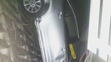 Car wedged between Gold Coast shopping complex and concrete wall. Picture: Supplied.