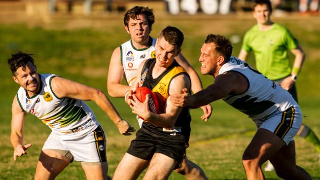 Broadview’s Kobi Russell surrounded by Salisbury North players during the sides’ clash at Broadview Oval on Saturday. Picture: Morgan Sette