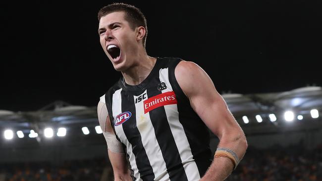AFL Round 17. 14/09/2020. ..  Collingwood vs Gold Coast Suns at the Gabba, Brisbane .   Mason Cox of the Magpies celebrates his goal in the fourth quarter   . Pic: Michael Klein