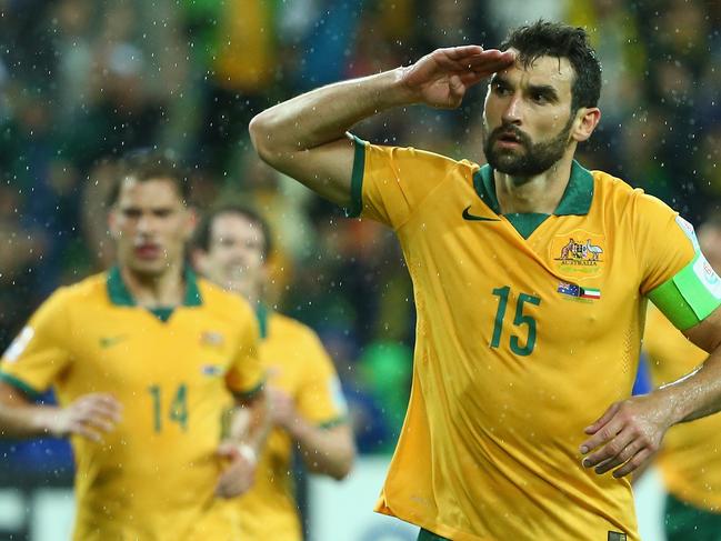 MELBOURNE, AUSTRALIA - JANUARY 09: Mile Jedinak of Australia celebrates after he scored a penalty during the 2015 Asian Cup match between the Australian Socceroos and Kuwait at AAMI Park on January 9, 2015 in Melbourne, Australia. (Photo by Robert Cianflone/Getty Images)