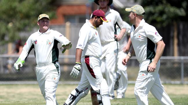 Keon Park captain-coach Ryan Docherty (right) celebrates a catch against Northern Socials.