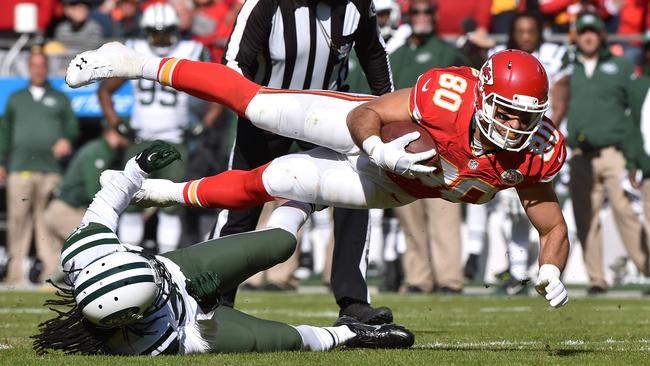 Anthony Fasano #80 of the Kansas City Chiefs dives over Marcus Williams.