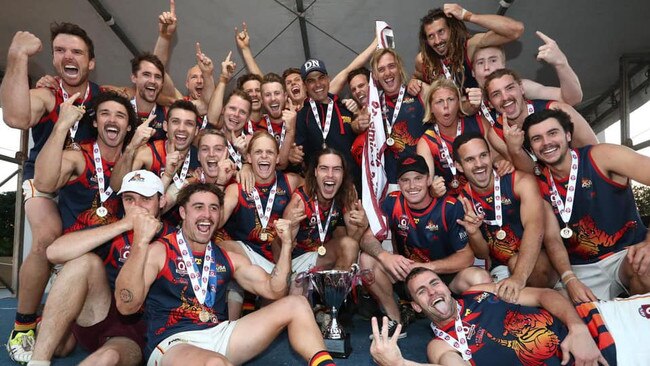 Head coach Adam Bovalino (centre) as the Noosa Tigers senior men's team celebrate winning the 2019 QFA Division 1 premiership.