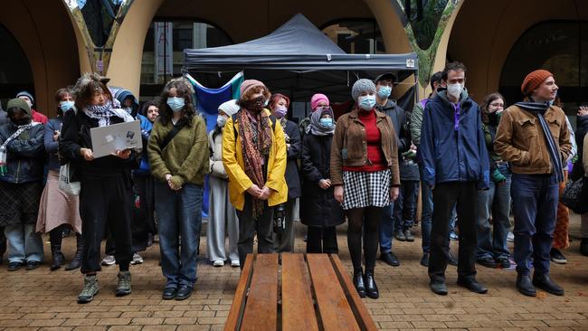 Protesters have form a picket line outside the Arts West building after they were ordered to leave. Picture: Mark Stewart