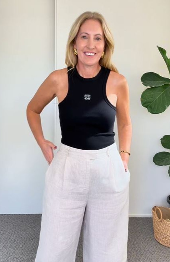 Kmart’s Sleeveless Rib Embroidery Tank comes in black or white with swirl design. Picture: Instagram/@hamptonhousewife