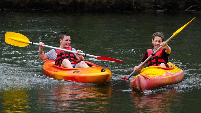 Tibooburra 11-year-old Tom Shiner and Hermidale 12-year-old Will Mudford enjoy a morning of kayaking at the Sydney Academy of Sport and Recreation in Narrabeen. Picture: Gaye Gerard