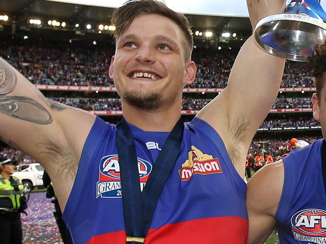 2016 AFL Grand Final match between the Western Bulldogs and the Sydney Swans at the Melbourne Cricket Ground (MCG), Melbourne, Australia on October 1, 2016. Western Bulldogs Clay Smith, Western Bulldogs Luke Dahlhaus and Western Bulldogs Matthew Boyd celebrate with the cup Picture Michel Klein