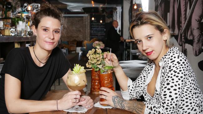 Pictured is Camille Mazuel and Marta Fernandes enjoying a cocktail at Pocket Bar in Darlinghurst. Venues offering live music can apply for new liquor licences.Picture: Christian Gilles