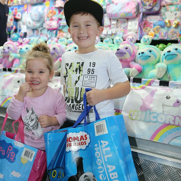 Cora and Jai Browne pick out showbags. Picture: Richard Gosling