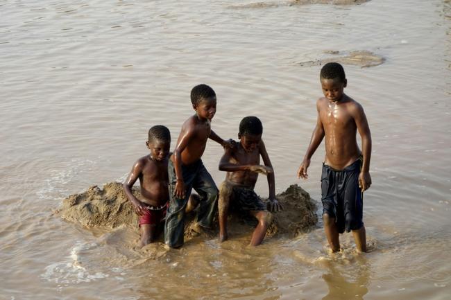 Children play in the waters of the Gash River some 600 kilometres from Sudanese capital Khartoum on June 6, 2024