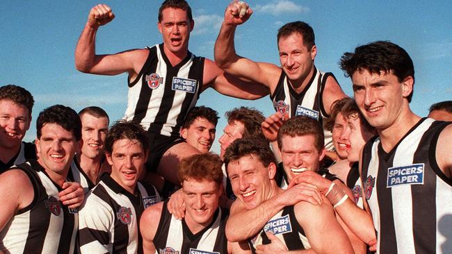 Craig Kelly (top right) is chaired from the ground after playing in his final AFL match.