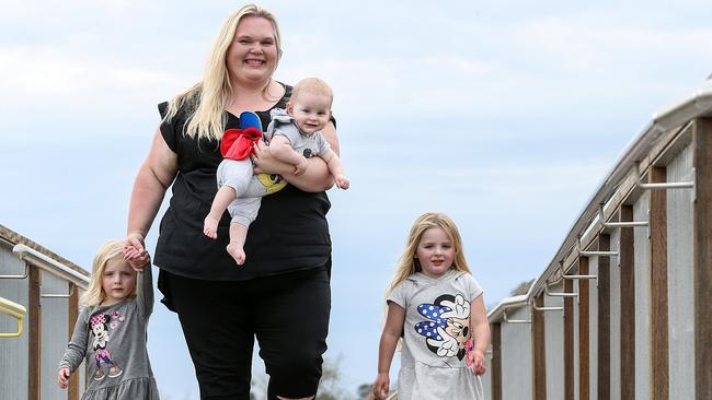 Anna-Sofia Rodwell with her three children Sofia, Lumi, and Olavi at a park in the new Atherstone Estate in Melton South. Picture: Ian Currie