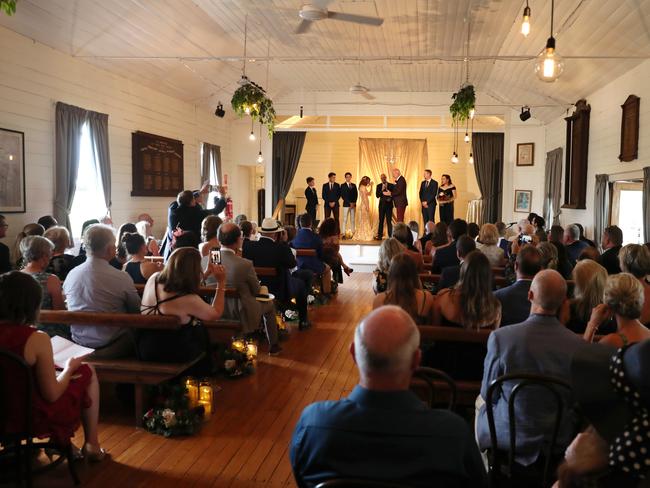 Robin Bailey and Sean Pickwell marry at Newrybar Community Hall, NSW. Picture: Liam Kidston