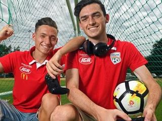 Adelaide United has selected Jamie O'Doherty (right) to represent it in the E-League. His brother Jordan plays for Adelaide United's A-League team.