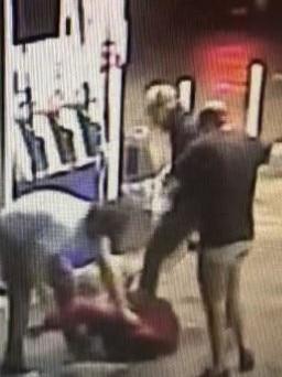 Three men allegedly attacking another man.