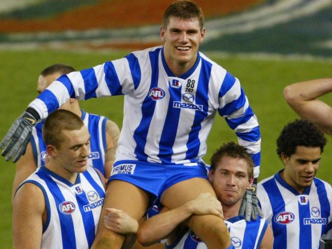 Jason McCartney is chaired off the ground in his comeback match.