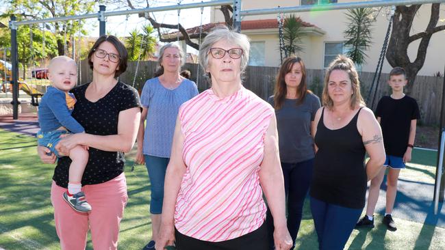 Katie Fraser with her baby Charlie Cox, Lindy Whitbread, Kaye Fraser, Jasmin Kukic, Louise Nikolakopoulos and Dean Lukic object to the boarding house being close to where many children live. Picture: Angelo Velardo