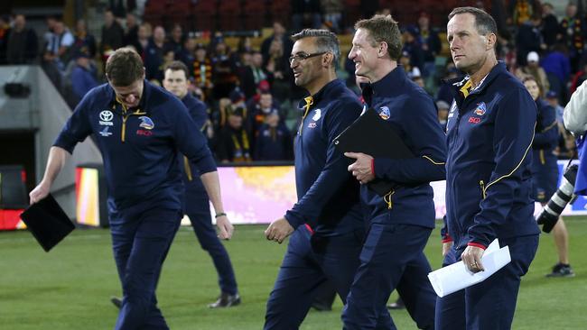 Senior assistant Scott Camporeale (second-left) and head of football Brett Burton (second-right) have been axed after the Crows’ external football department review — a month after coach Don Pyke (right) resigned. Picture: Sarah Reed