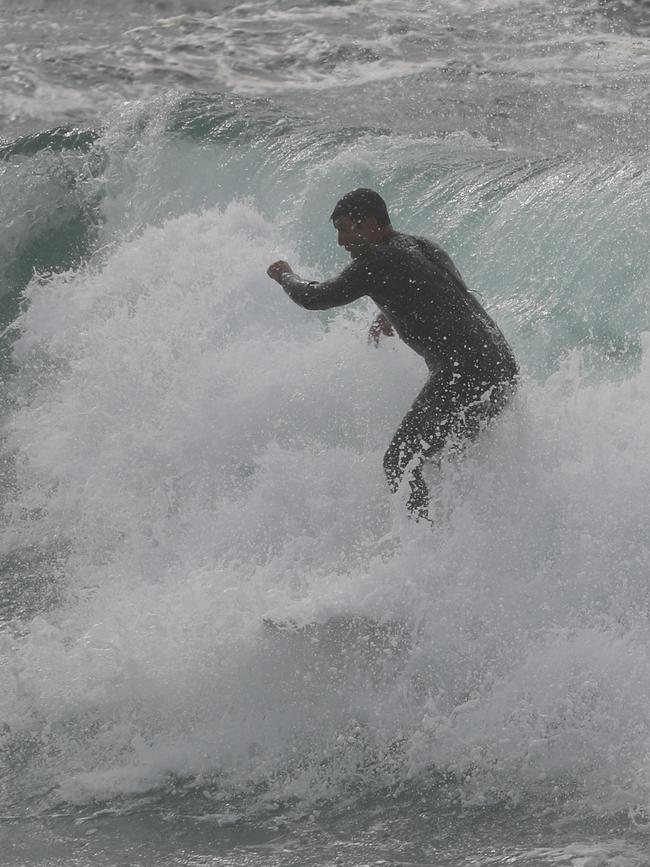 Johns caught only a few waves before heading back. Picture John Grainger