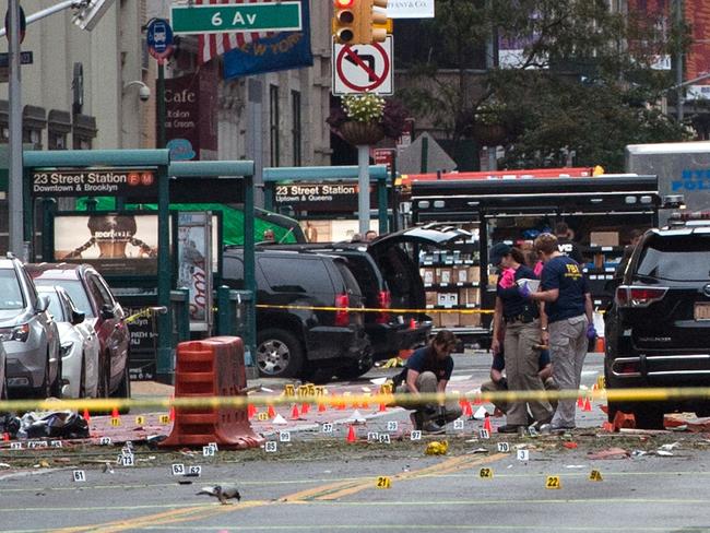 FBI agents investigate the crime scene on 23rd Street in Manhattan's Chelsea neighbourhood. Picture: Stephanie Keith/Getty Images/AFP