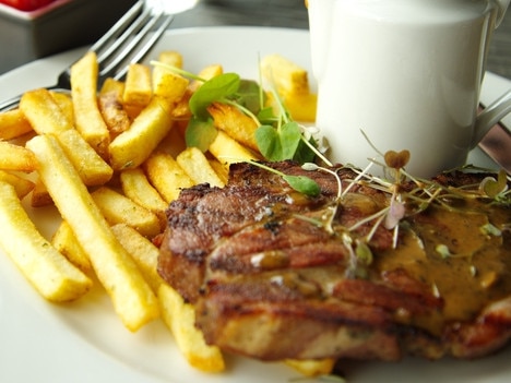 RendezView. Beef steak with french fried in white plate on table in restaurant. (Pic: iStock)