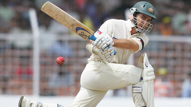 Justin Langer plays a sweep shot against India in 2004.