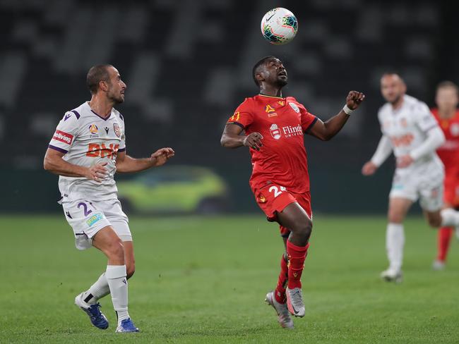 SYDNEY, AUSTRALIA - JULY 30: Tarek Elrich of the Glory and Pacifique Niyongabire of United compete for the ball during the round 28 A-League match between Adelaide United and the Perth Glory at Bankwest Stadium on July 30, 2020 in Sydney, Australia. (Photo by Matt King/Getty Images)