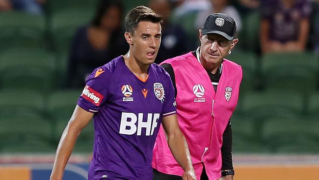 Perth Glory’s Chris Ikonomidis leaves the field with a knee injury last Saturday