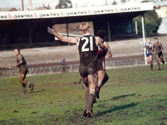 Darren Murr takes a kick for St Kilda's reserves at a muddy Arden St in 1991.