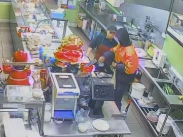 CCTV footage shows the robber inside the restaurant, interacting with a staff member.