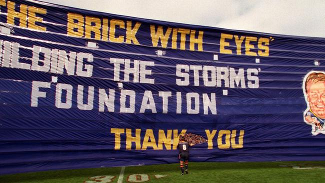 Melbourne Storm captain Glenn Lazarus makes his entrance through the first ever Storm banner in 1999. Picture: Graham Crouch.