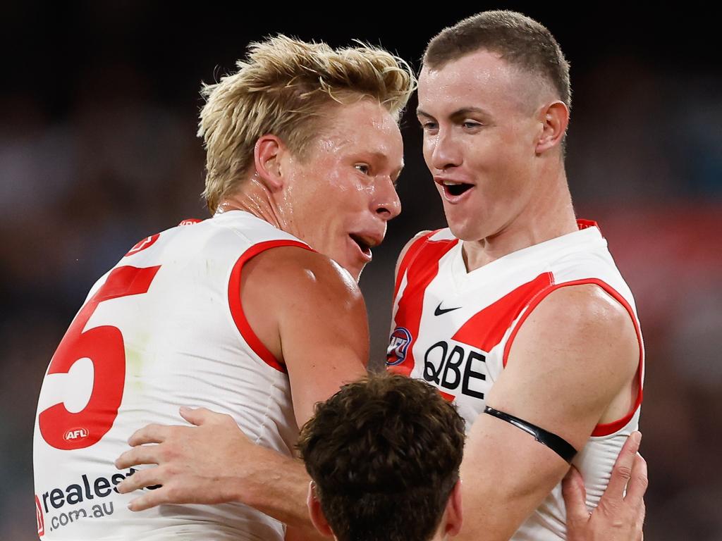 MELBOURNE, AUSTRALIA - MARCH 15: Chad Warner of the Swans celebrates a goal with teammate Isaac Heeney during the 2024 AFL Round 01 match between the Collingwood Magpies and the Sydney Swans at the Melbourne Cricket Ground on March 15, 2024 in Melbourne, Australia. (Photo by Dylan Burns/AFL Photos via Getty Images)