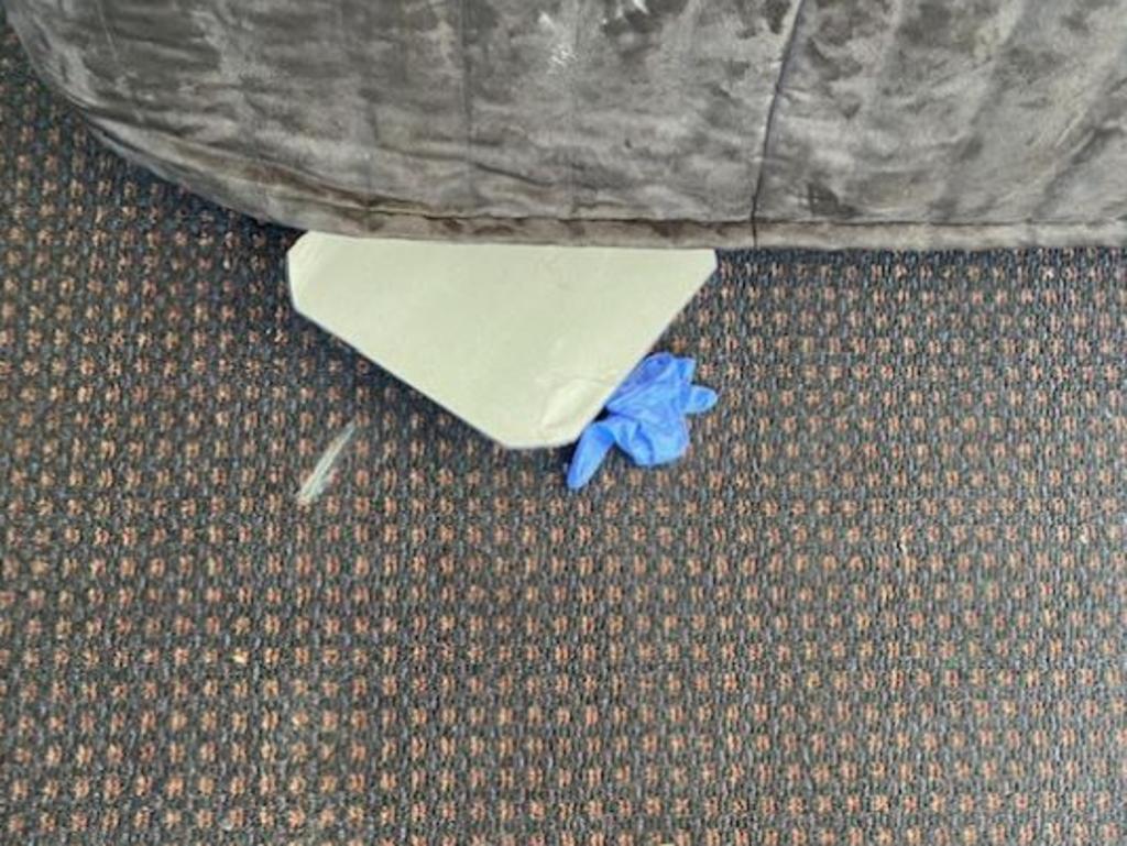 A used glove and a children’s toy were found under the bed. Image supplied.