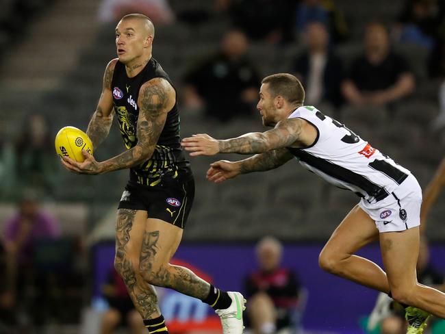 MELBOURNE, AUSTRALIA - MARCH 05: Dustin Martin of the Tigers and Jeremy Howe of the Magpies in action during the 2021 AAMI Community Series match between the Collingwood Magpies and the Richmond Tigers at Marvel Stadium on March 5, 2021 in Melbourne, Australia. (Photo by Michael Willson/AFL Photos via Getty Images)