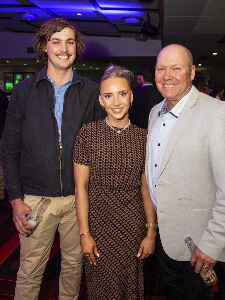 Downs and Western Housing and Construction Awards hostess Maddy Davies with Lincoln Adams (left) and Mark Davies at Rumours International, Friday, July 22, 2022. Picture: Kevin Farmer