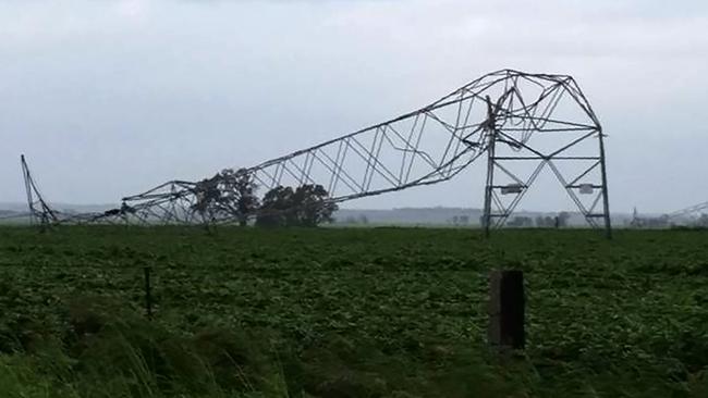 Transmission towers toppled by high winds near Melrose last week. Picture: AFP/Debbie Prosser