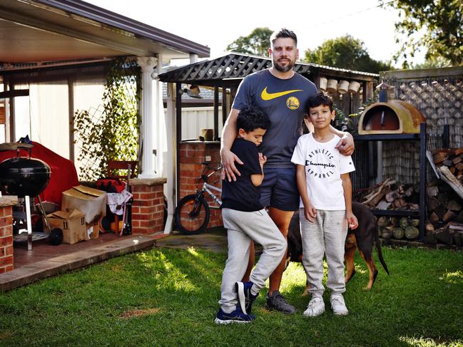 Milan Mikac with sons Lukas (right) and Jacob (left) at his home, which suffered extensive damage due to the blast. Picture: Sam Ruttyn