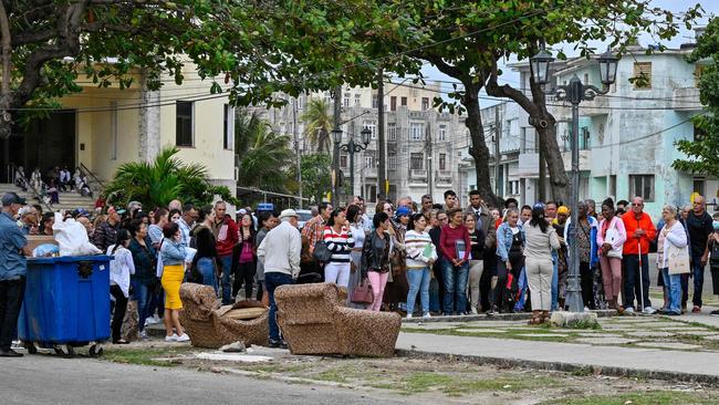 Cubans wait to enter the US embassy in Havana to apply for a visa, a day after Joe Biden decided to remove Cuba from the list of countries that sponsor terrorism. Picture: AFP