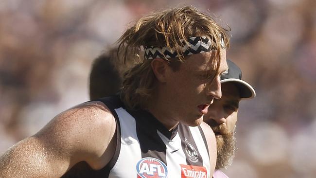 MELBOURNE, AUSTRALIA - SEPTEMBER 30: Nathan Murphy of the Magpies leaves the field with trainers during the 2023 AFL Grand Final match between Collingwood Magpies and Brisbane Lions at Melbourne Cricket Ground, on September 30, 2023, in Melbourne, Australia. (Photo by Daniel Pockett/AFL Photos/via Getty Images)