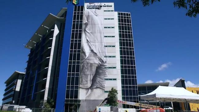 Guido van Helten paints mural at Southern Cross University