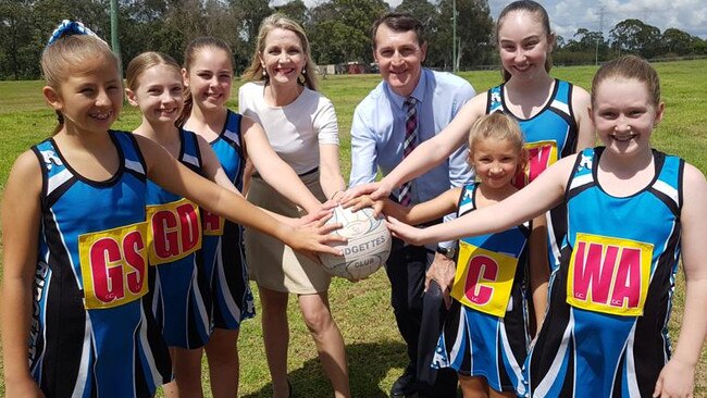 Cr Amanda Cooper and former Lord Mayor Graham Quirk, both centre, with players from the Ridgettes Netball Club at the announcement of a $7 million netball precinct at Fitzgibbon in November 2018 . Picture: Ellen-Maree Elliot